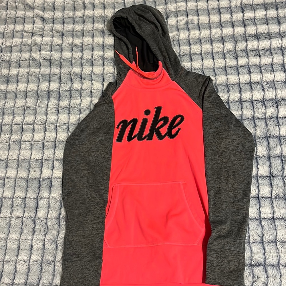 Neon pike and gray nike sweatshirt size 14. Slightly worn and not damaged.